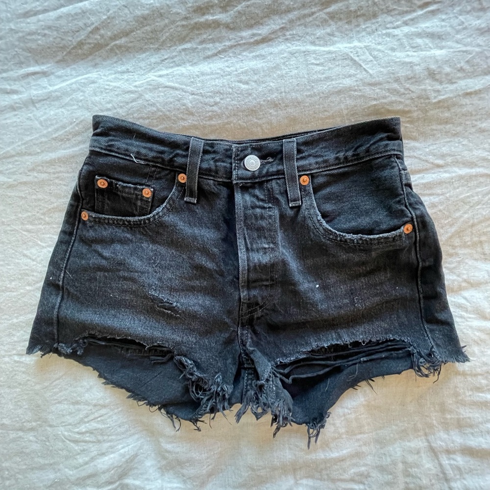 Levi black denim cut off shorts.